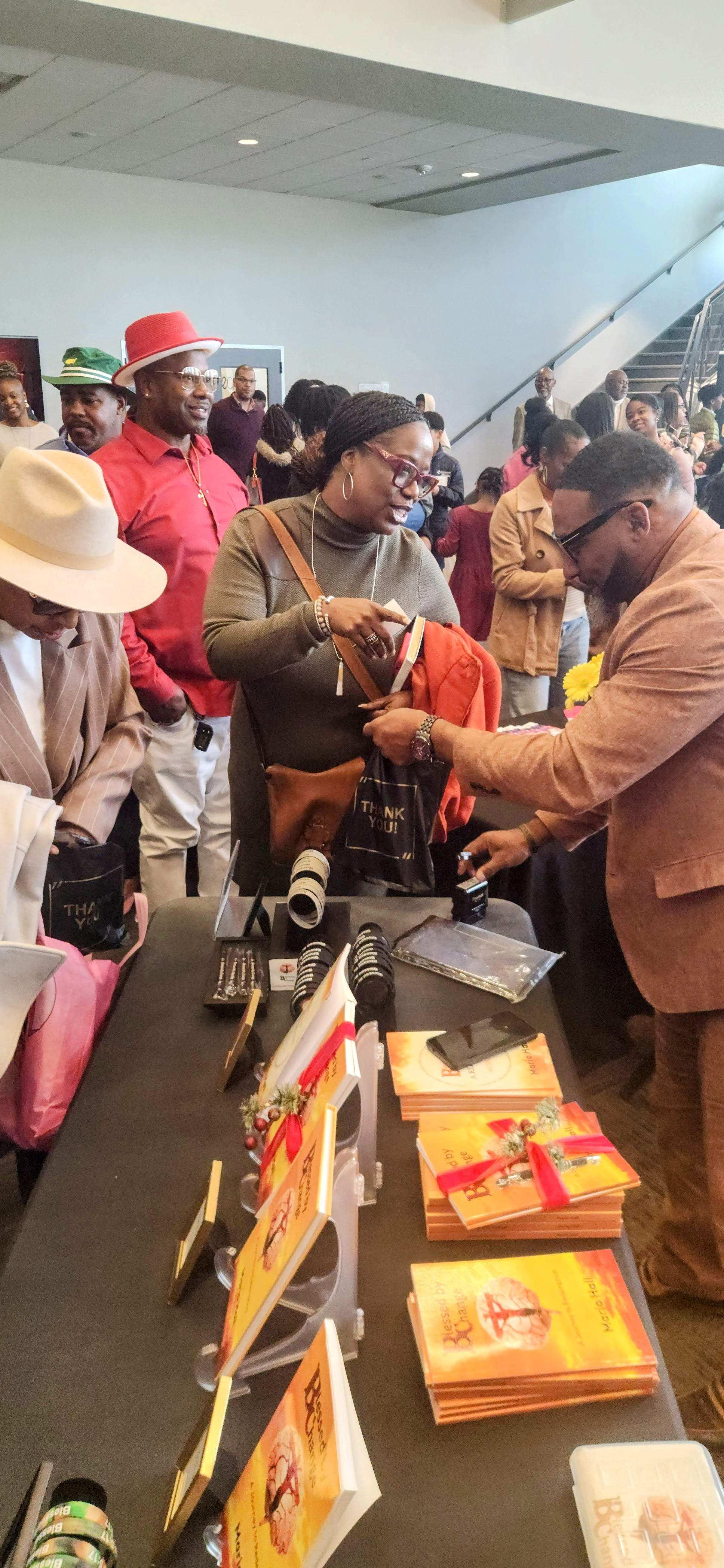 Mario Hall signing books at Greater Mount Zion Church event